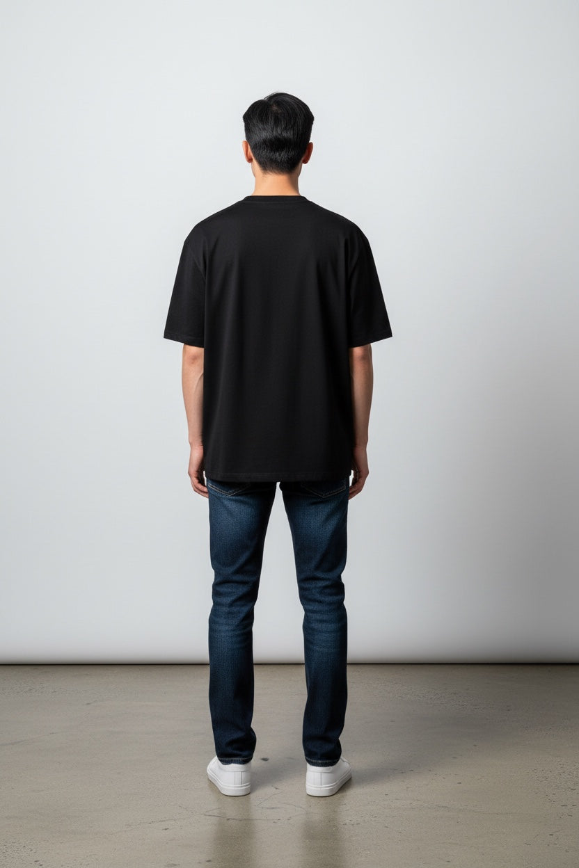 Pavel & Co Metropolis black heavyweight cotton French Terry boxy t-shirt with drop shoulders, back view on a model.
