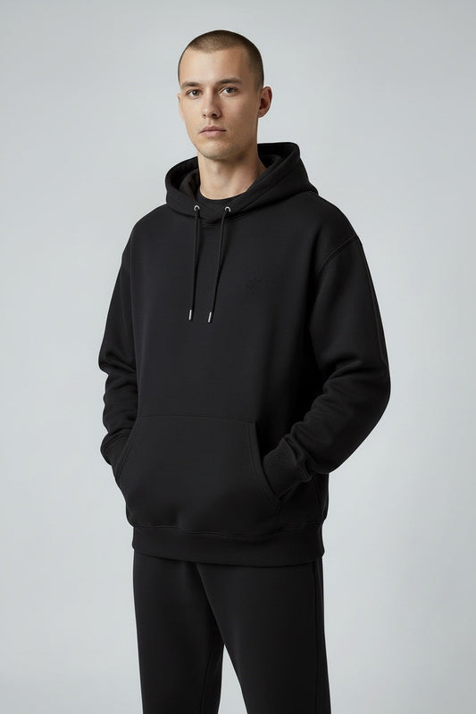 Pavel & Co black oversized unisex hoodie in heavyweight cotton-blend loopknit with a kangaroo pocket and hood.