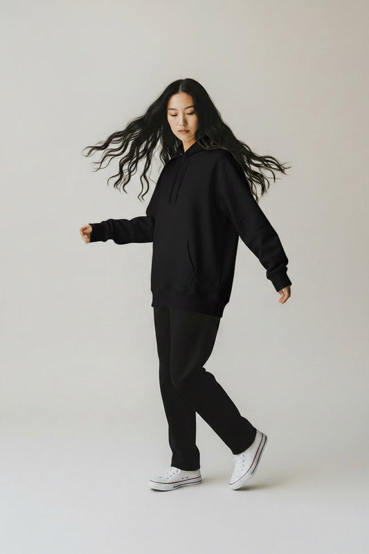 Pavel & Co oversized black heavyweight cotton-blend hoodie with dropped shoulders and kangaroo pocket on a model