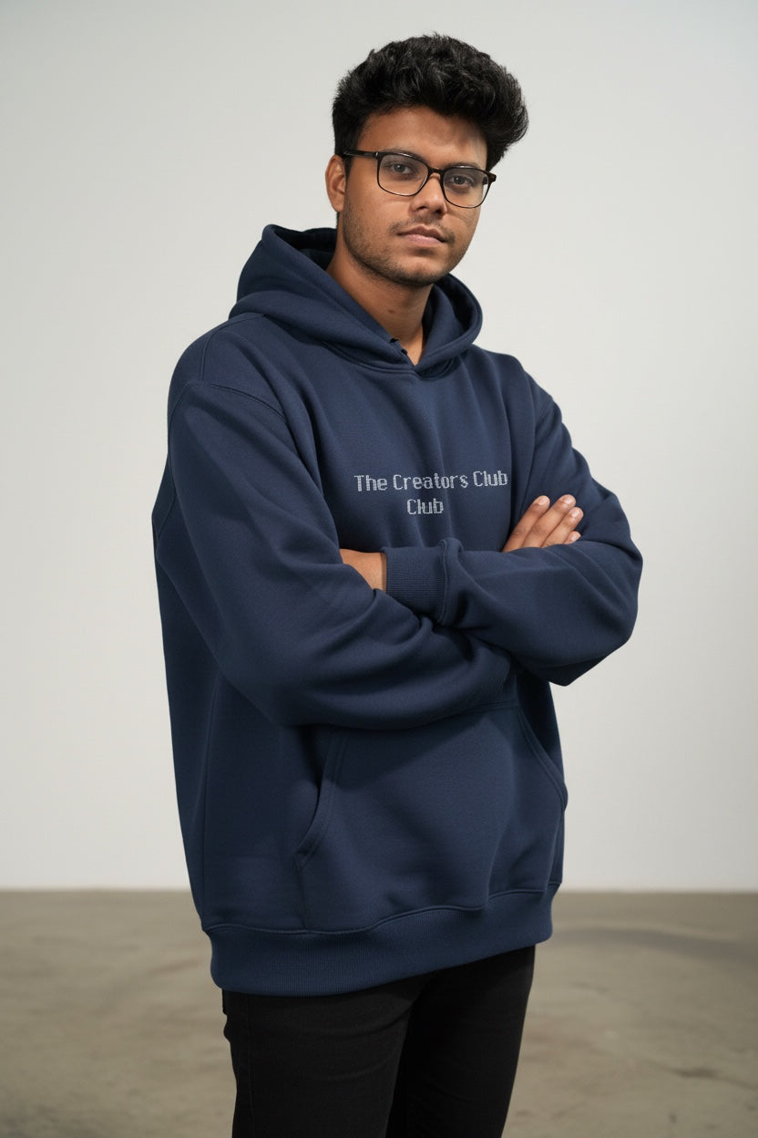 Pavel & Co navy blue oversized heavyweight cotton-blend hoodie with The Creators Club embroidery on a male model
