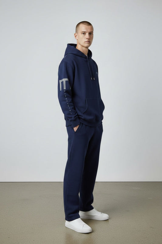 Pavel & Co navy blue oversized cotton-blend hoodie with sleeve print and kangaroo pocket worn by a male model