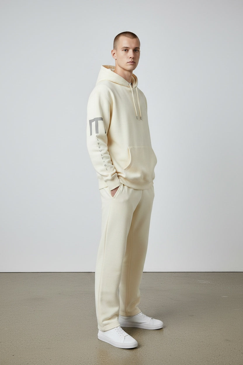 Pavel & Co oversized cream cotton-blend hoodie with dropped shoulders and graphic sleeve print on a male model